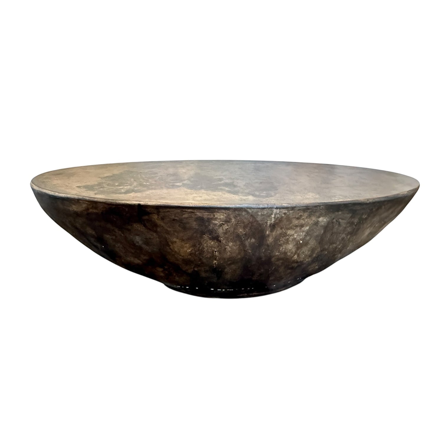 Grand Expressions Gallery and Home Store oval concrete cocktail table with botanical leaf impressions and dark finish.