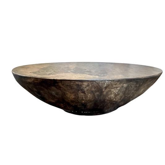 Grand Expressions Gallery and Home Store oval concrete cocktail table with botanical leaf impressions and dark finish.