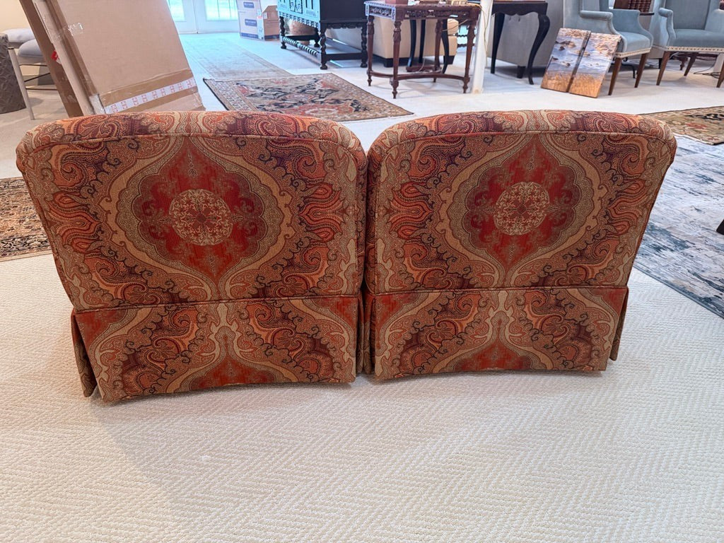 Pair of Grand Expressions Gallery and Home Store bohemian paisley slipper chairs in warm orange and brown tones.