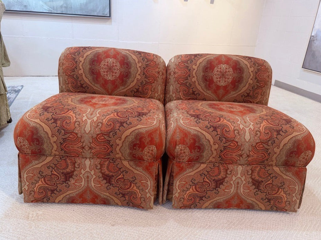 Pair of Grand Expressions Gallery and Home Store bohemian paisley slipper chairs in rust and gold tones.