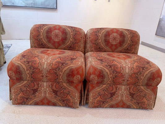 Pair of Grand Expressions Gallery and Home Store bohemian paisley slipper chairs in rust and gold tones.