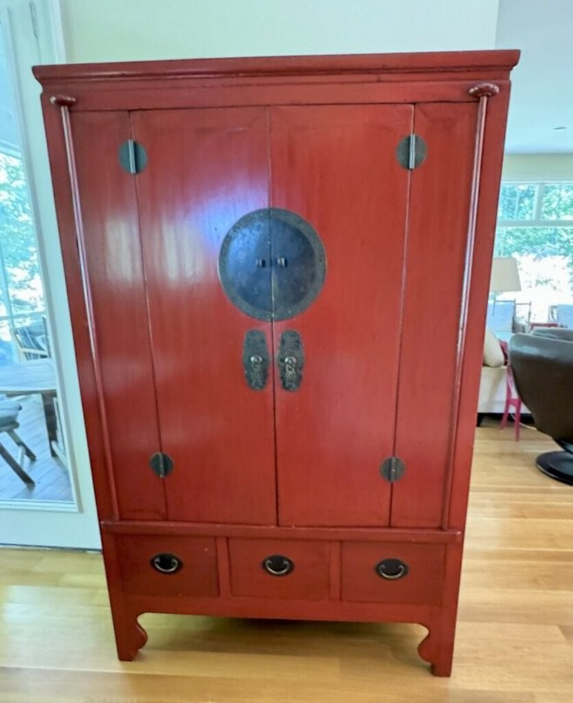 Grand Expressions Gallery and Home Store red lacquer Asian media cabinet with brass hardware and three base drawers.