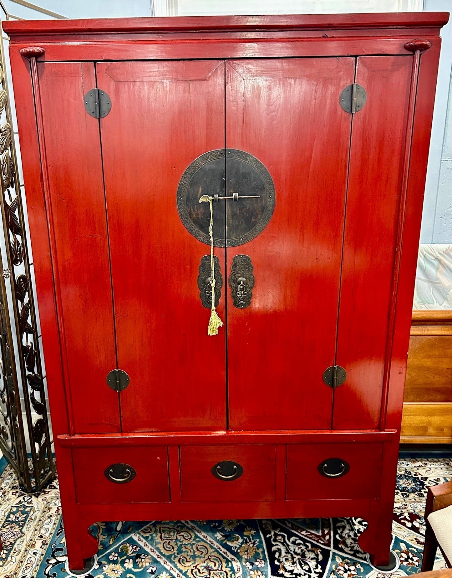 Grand Expressions Gallery and Home Store 19th century Asian red lacquer elm wood media cabinet with brass hardware.