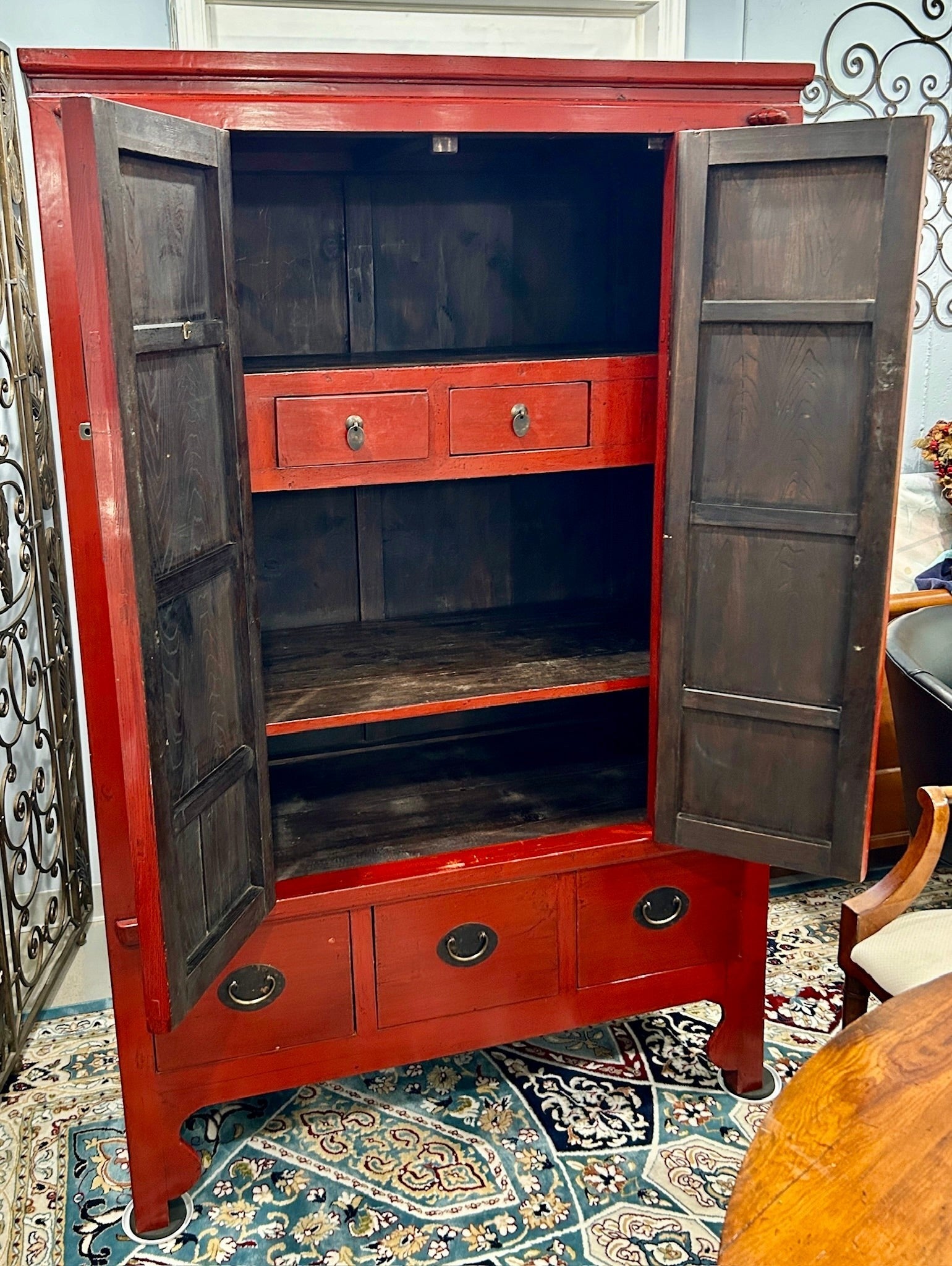 Grand Expressions Gallery and Home Store 19th-century red lacquer elm wood media cabinet with brass hardware.