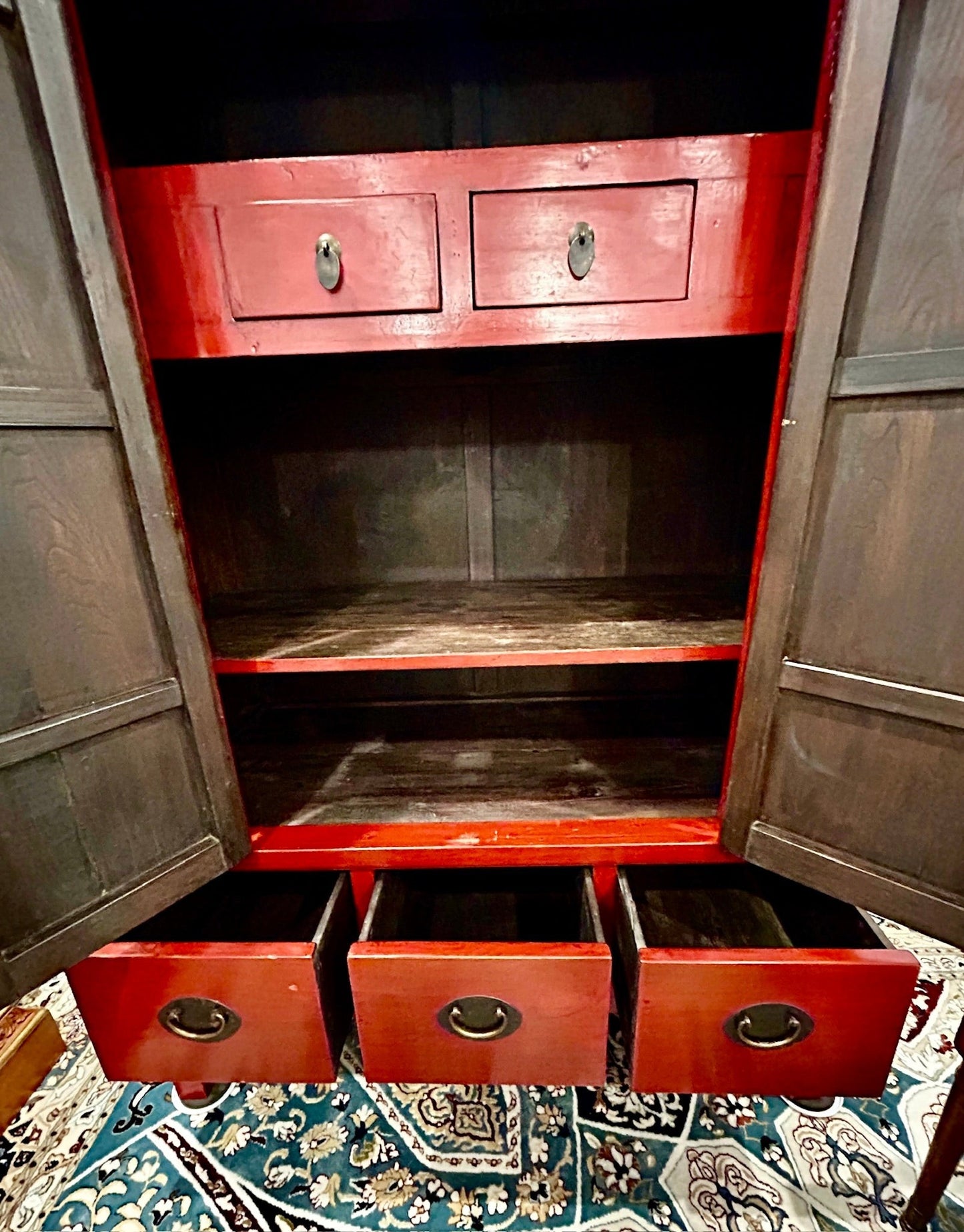 Grand Expressions Gallery and Home Store red lacquer elm wood media cabinet with brass hardware and interior drawers.