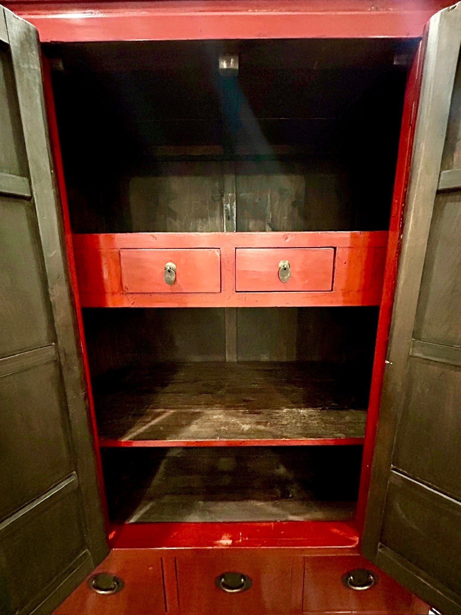 Grand Expressions Gallery and Home Store red lacquer elm wood media cabinet interior with shelves and brass hardware.