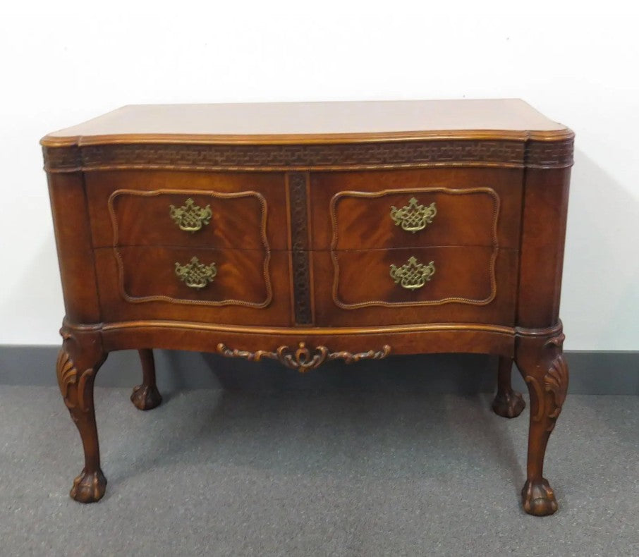 Vintage Robert W. Irwin Company chest of drawers at Grand Expressions Gallery and Home Store with ornate carvings.