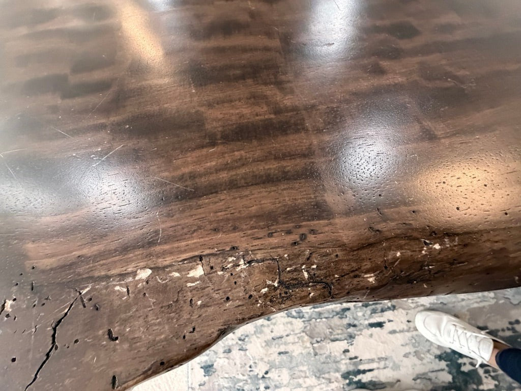 Grand Expressions Gallery and Home Store Restoration Hardware natural slab wood dining table with live edge detail.