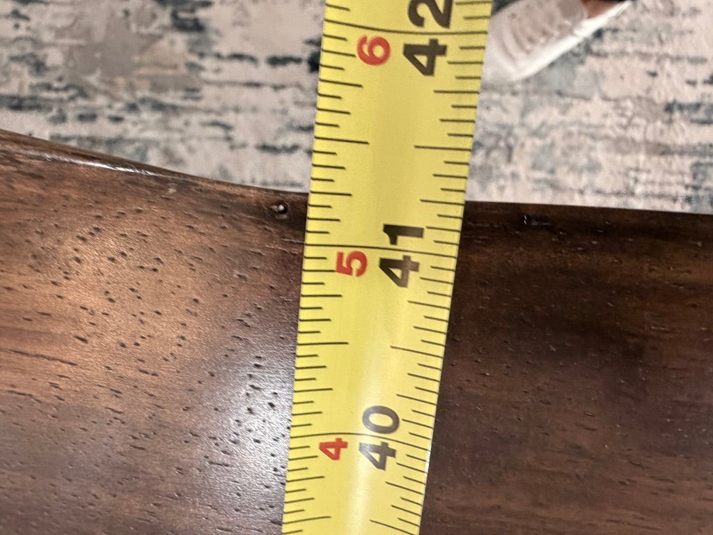 Grand Expressions Gallery and Home Store natural slab wood dining table with measuring tape showing 41 inch width