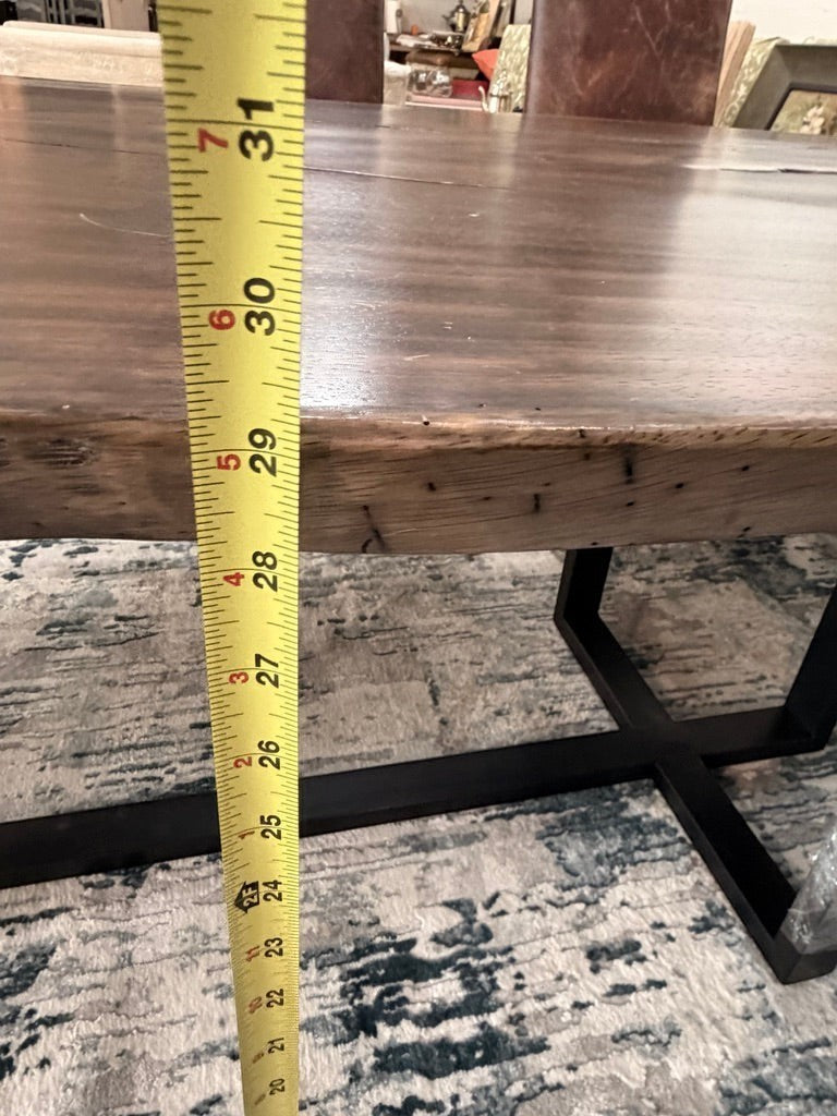 Grand Expressions Gallery and Home Store natural slab wood dining table with black metal base and 30-inch height.