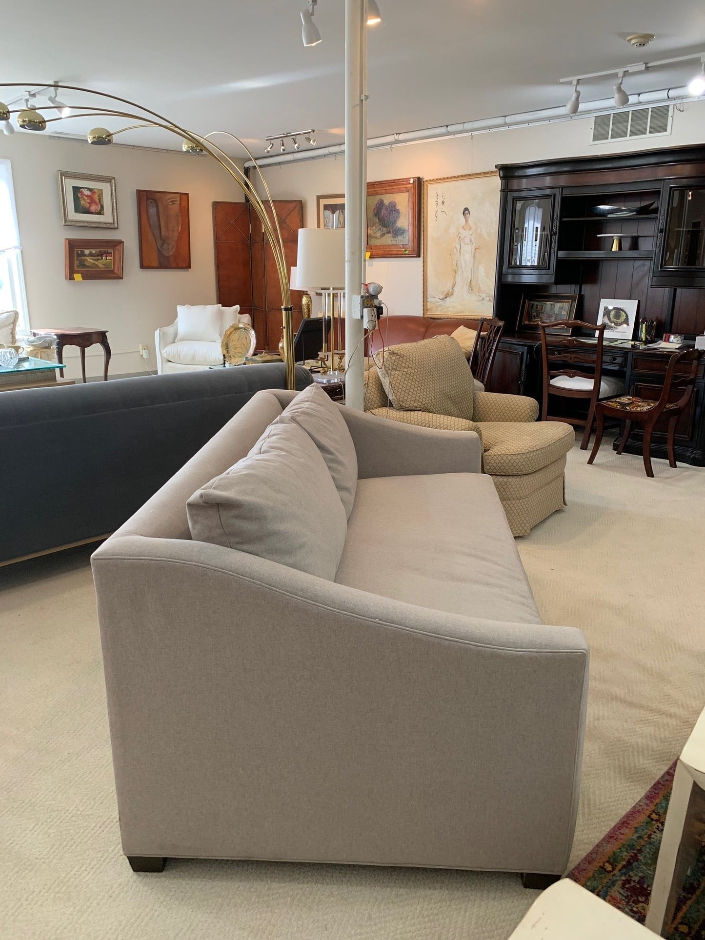 The Sullivan Sofa by Maiden Home in light grey fabric with shelter arms, displayed at Grand Expressions Gallery.