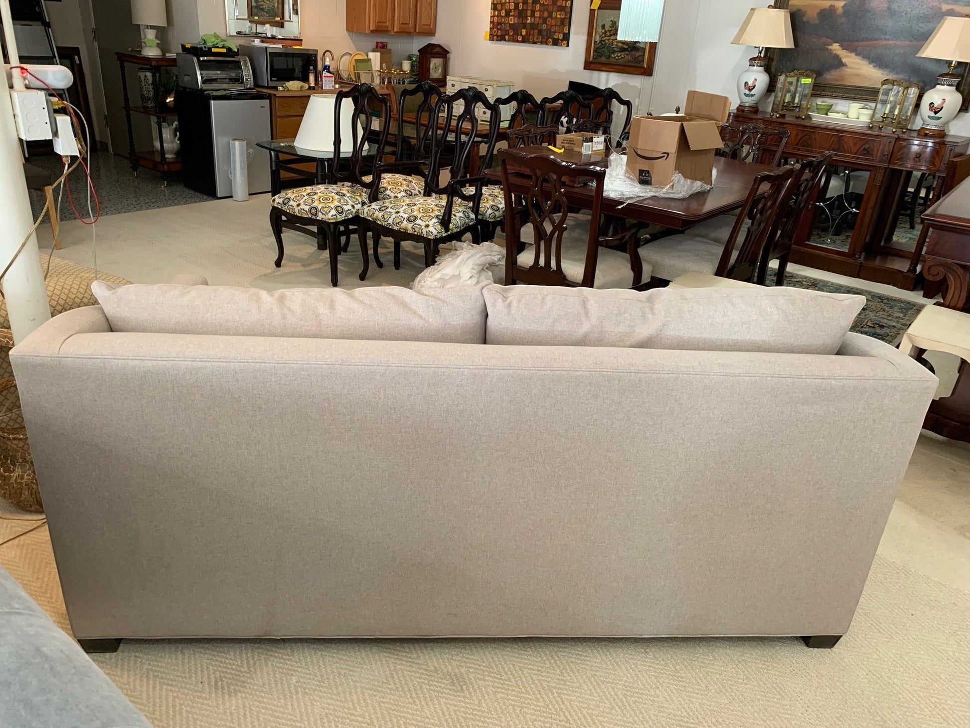 Back view of the beige Sullivan sofa by Grand Expressions Gallery and Home Store featuring shelter arms.