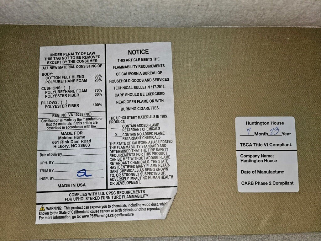 Grand Expressions Gallery and Home Store product tag for The Sullivan Sofa by Maiden Home, showing material details.