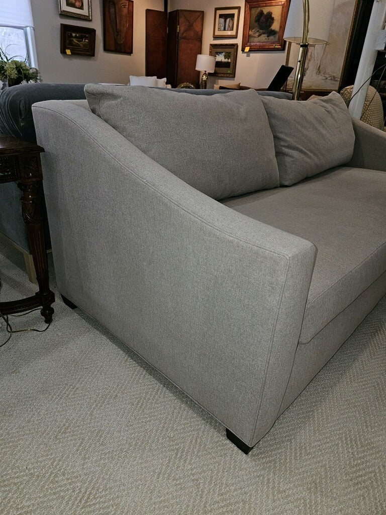 Grand Expressions Gallery and Home Store Sullivan sofa in grey fabric with shelter arms and loose back cushions.