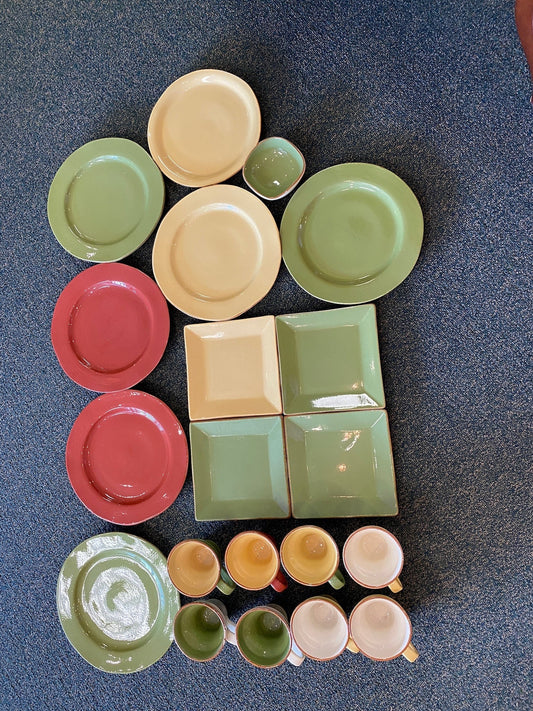 Grand Expressions Gallery and Home Store Vietri Cucina Fresca 20-piece clay dinnerware set in assorted colors.