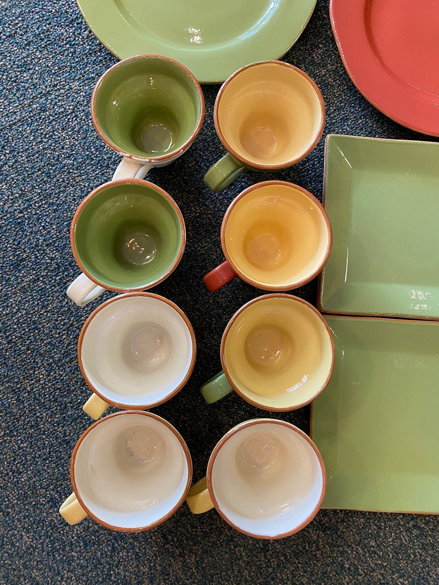 Grand Expressions Gallery and Home Store Vietri Cucina Fresca clay dinnerware set with colorful plates and mugs.