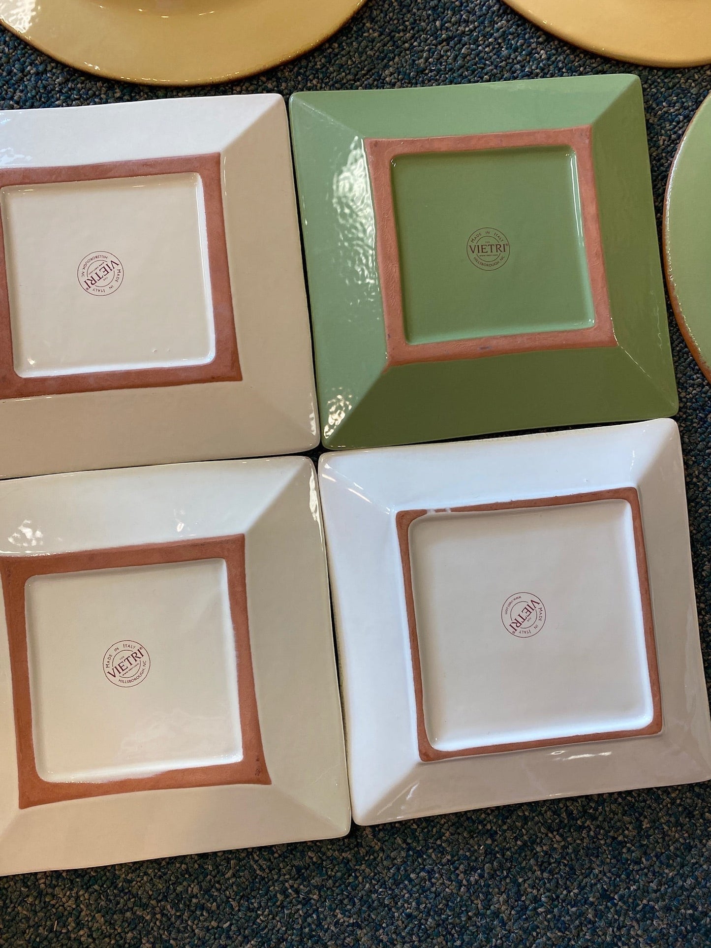 Grand Expressions Gallery and Home Store Vietri Cucina Fresca clay plates with Italian maker marks on the underside.