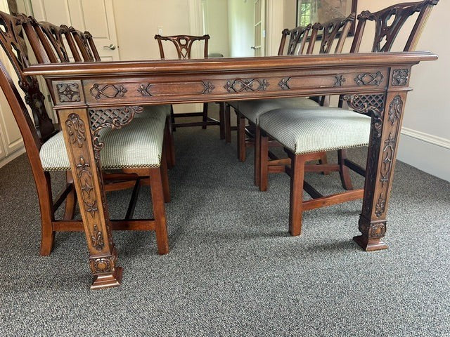 Vintage Asian style wooden dining table by Grand Expressions Gallery and Home Store with intricate carved details.