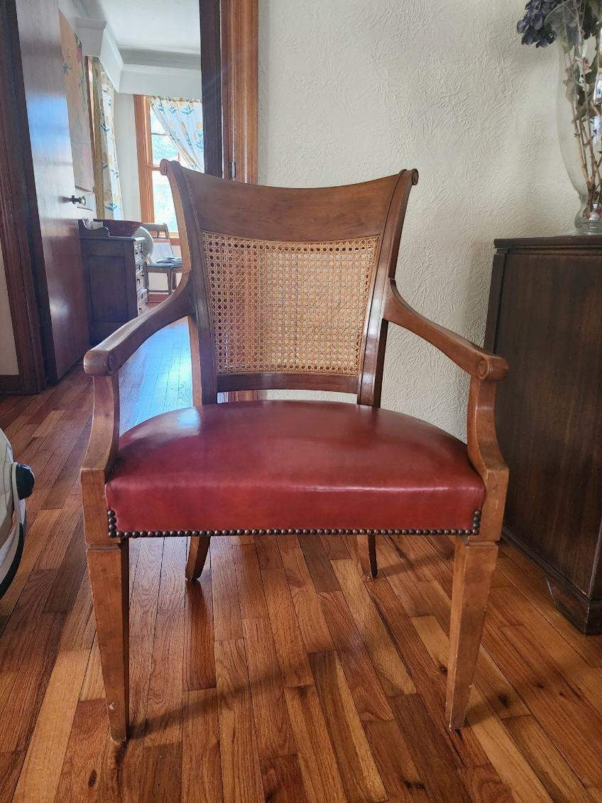 Grand Expressions Gallery and Home Store vintage Baker dining chair with cane back and red leather seat.
