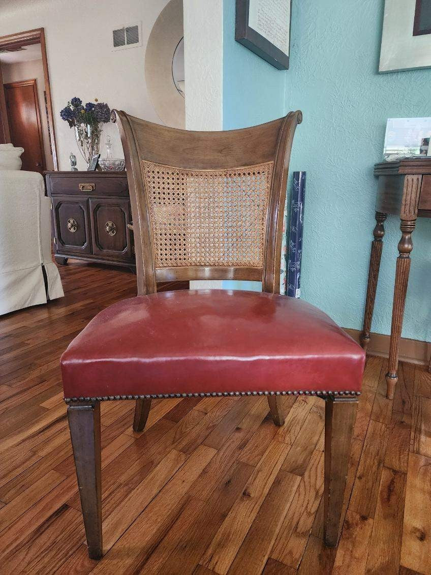 Grand Expressions Gallery and Home Store vintage Baker dining chair with cane back and red leather seat.