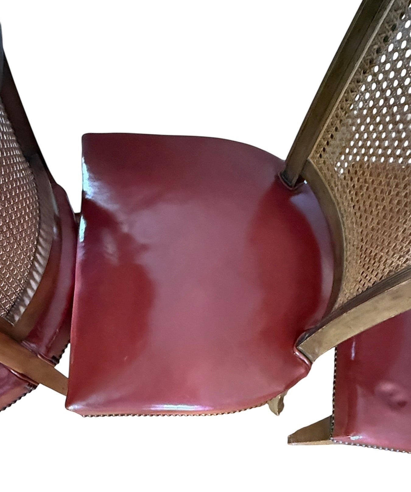 Set of 4 Grand Expressions Gallery and Home Store vintage Baker dining chairs with cane backs and red leather seats.