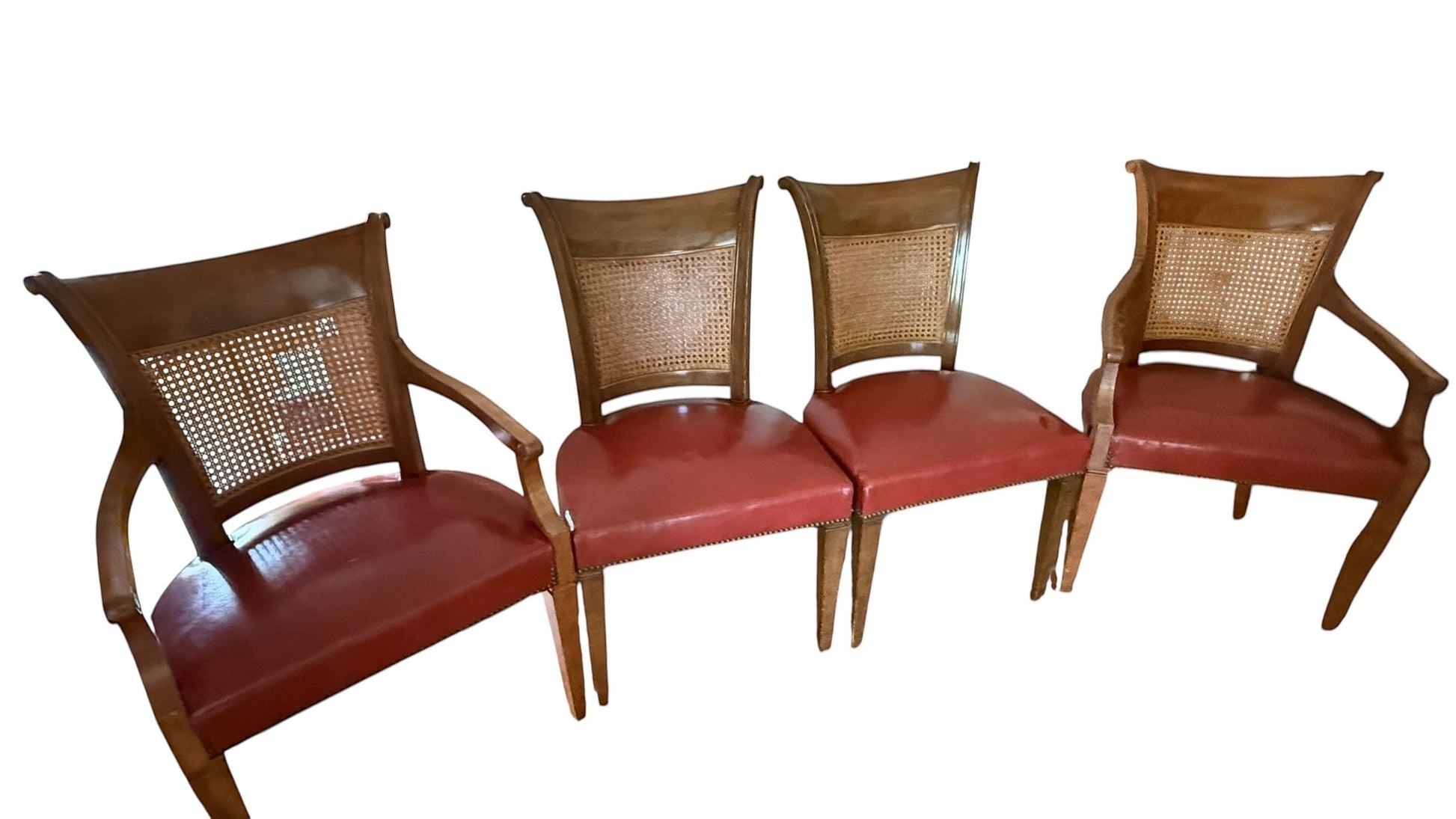 Set of 4 vintage Baker furniture dining chairs with cane backrests and red leather seats from Grand Expressions Gallery and Home Store.