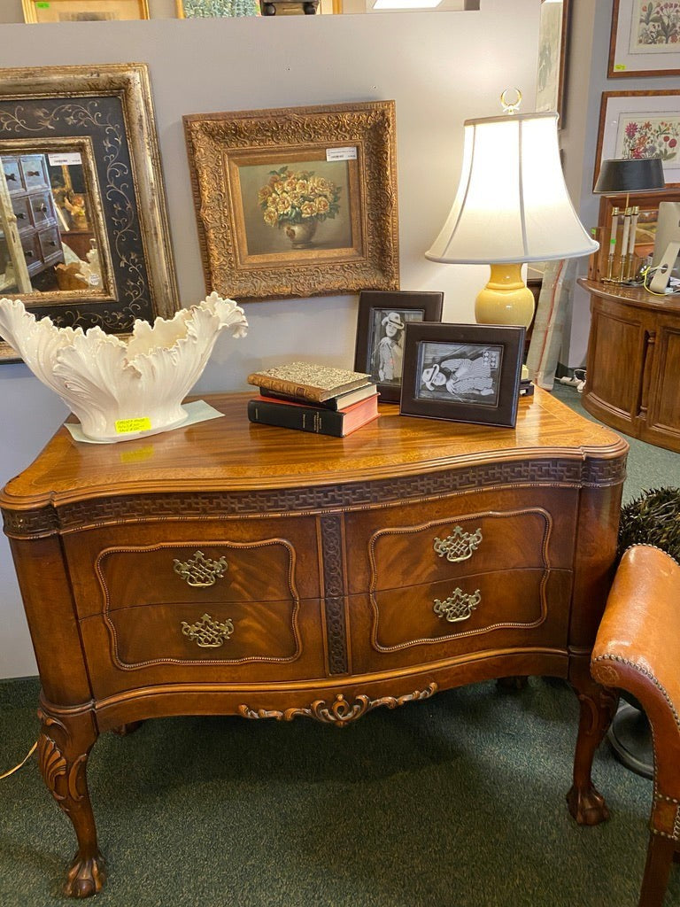 Grand Expressions Gallery and Home Store vintage Robert W. Irwin chest of drawers with wood finish and carved legs.