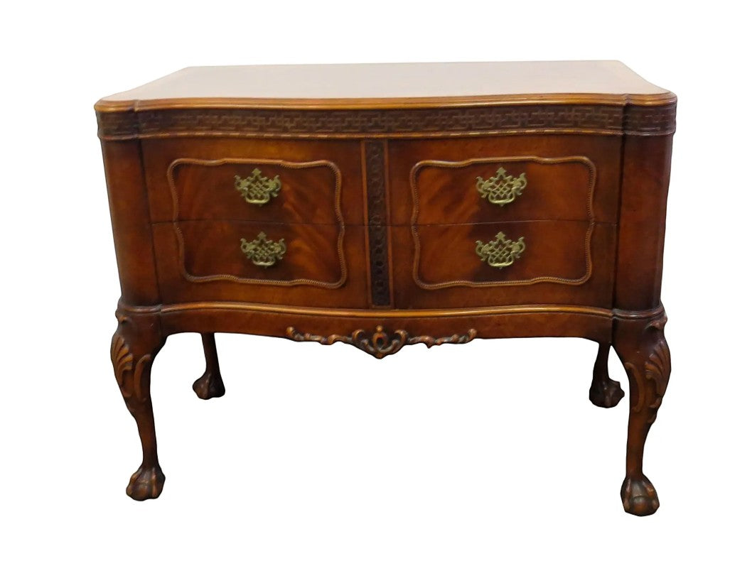 Vintage Robert W. Irwin chest of drawers from Grand Expressions Gallery and Home Store with elegant carvings and legs.