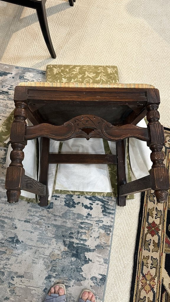Underside view of a Grand Expressions Gallery and Home Store vintage English walnut dining chair with carved apron.