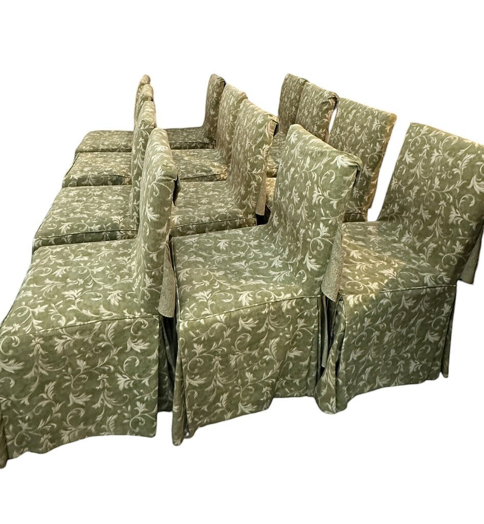 Set of 12 vintage English walnut dining chairs from Grand Expressions Gallery and Home Store with green floral covers.