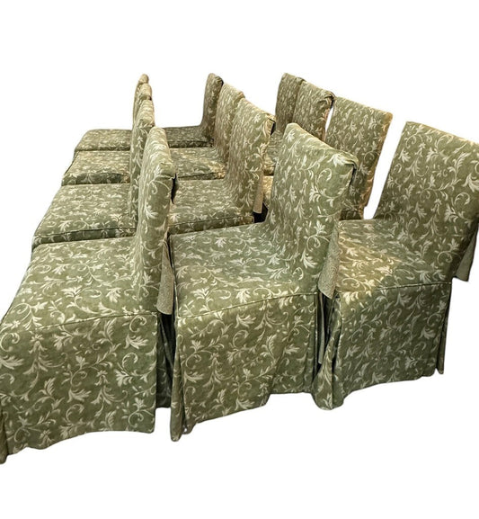 Set of 12 vintage English walnut dining chairs from Grand Expressions Gallery and Home Store with green floral covers.