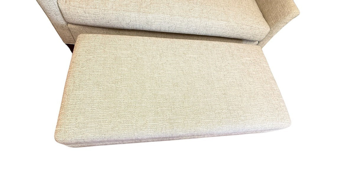 Grand Expressions Gallery and Home Store Wesley Hall light beige settee and matching ottoman in performance fabric.