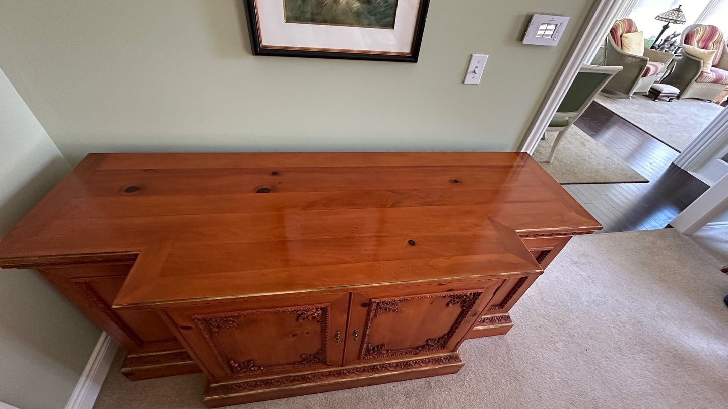 Grand Expressions Gallery and Home Store traditional wooden credenza with ornate carvings and warm finish.