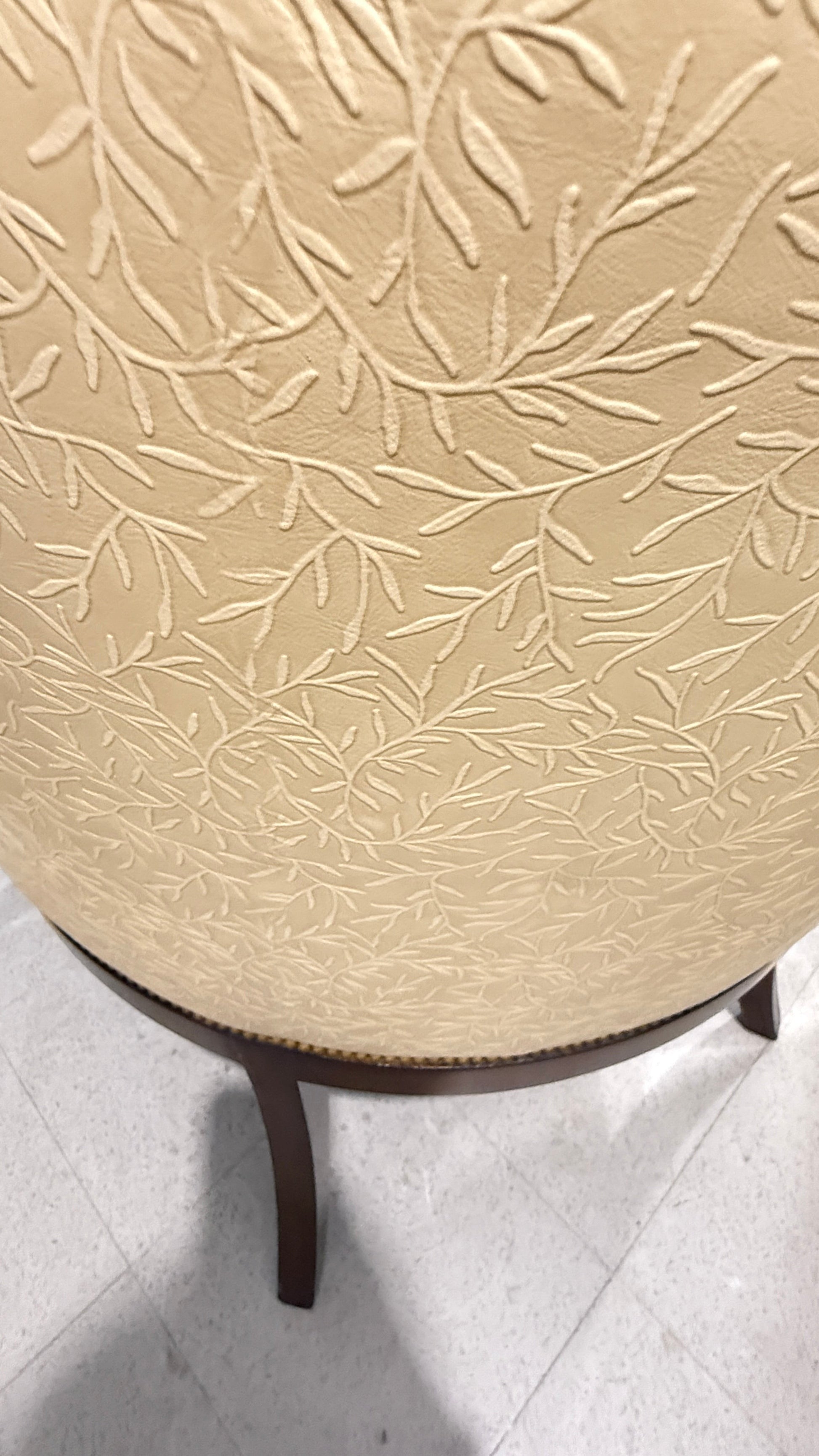 Grand Expressions Gallery and Home Store butter yellow accent chair with embossed floral pattern and mahogany legs.